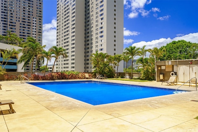 view of swimming pool with a patio