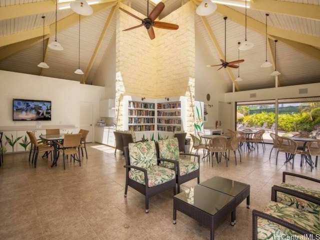 living room with beamed ceiling, high vaulted ceiling, and ceiling fan