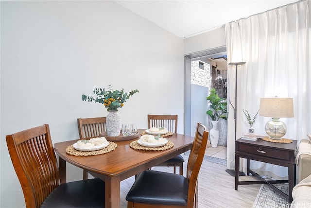 dining space featuring light hardwood / wood-style floors