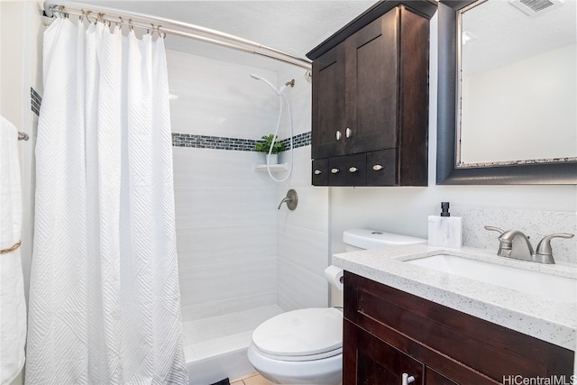 bathroom featuring a shower with curtain, toilet, and vanity