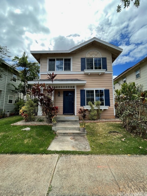 view of front of property with a front lawn