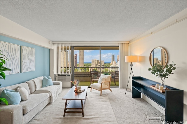 carpeted living room featuring cooling unit and a textured ceiling