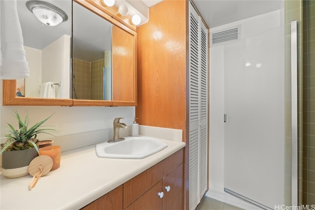 bathroom with vanity and tile patterned flooring