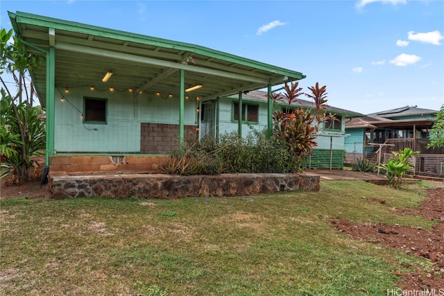 back of house with a yard