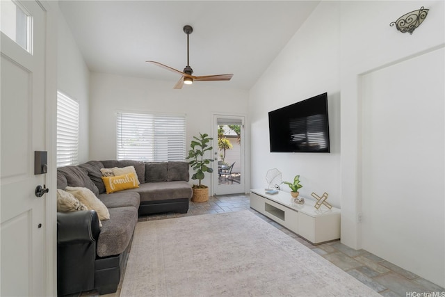 91-1061 Kaileolea Dr Unit 2C1, Ewa Beach, HI 96706 - living room featuring a ceiling fan, stone tile flooring, and lofted ceiling