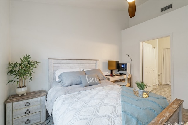 bedroom with ensuite bathroom and ceiling fan