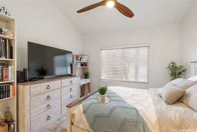 bedroom with ceiling fan and vaulted ceiling