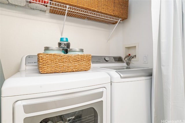 washroom with washer and clothes dryer