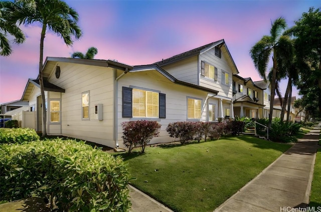 view of front of home featuring a lawn