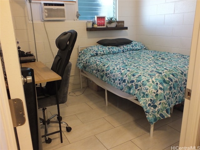 bedroom with tile walls, cooling unit, and tile patterned flooring