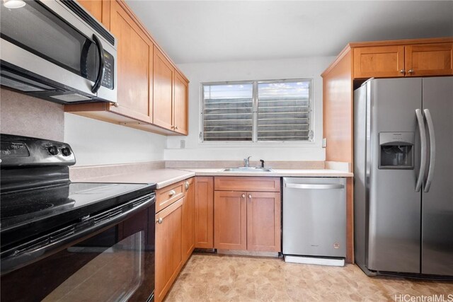 kitchen featuring sink and appliances with stainless steel finishes