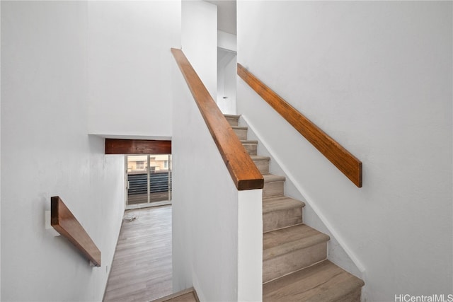 staircase featuring wood finished floors