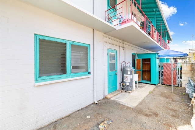 property entrance featuring water heater