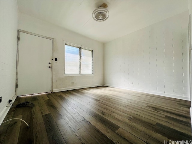 spare room featuring dark hardwood / wood-style floors