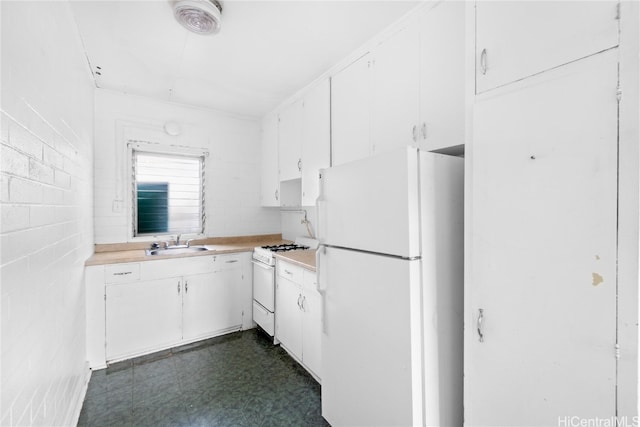 kitchen featuring white cabinets, sink, and white appliances