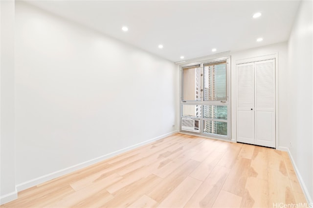 empty room with light wood-type flooring