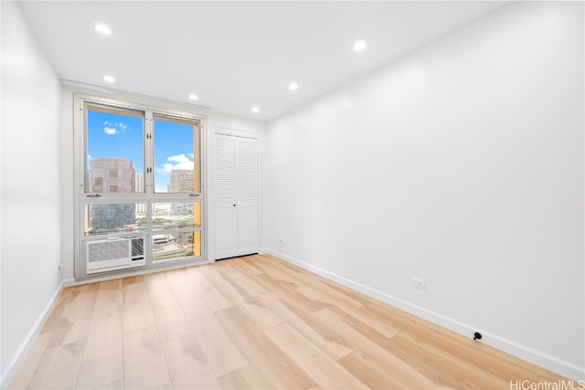 spare room featuring light hardwood / wood-style flooring