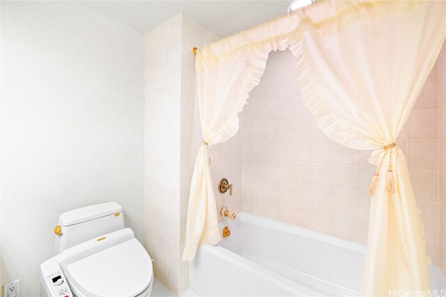 bathroom with toilet and shower / bath combo with shower curtain