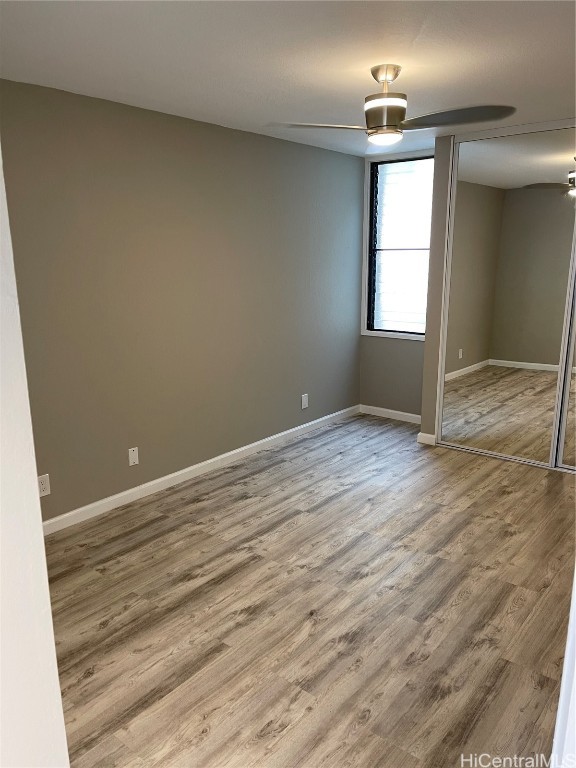 empty room featuring wood-type flooring