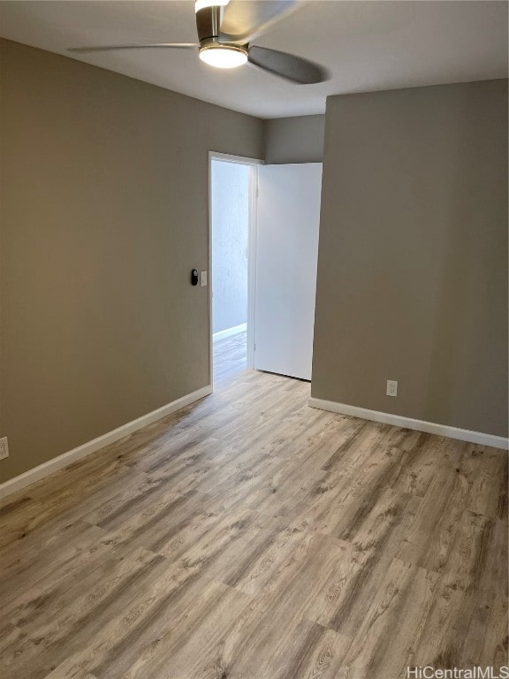 empty room featuring light hardwood / wood-style floors and ceiling fan