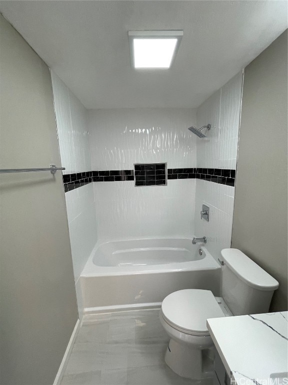 full bathroom with toilet, tiled shower / bath combo, and vanity