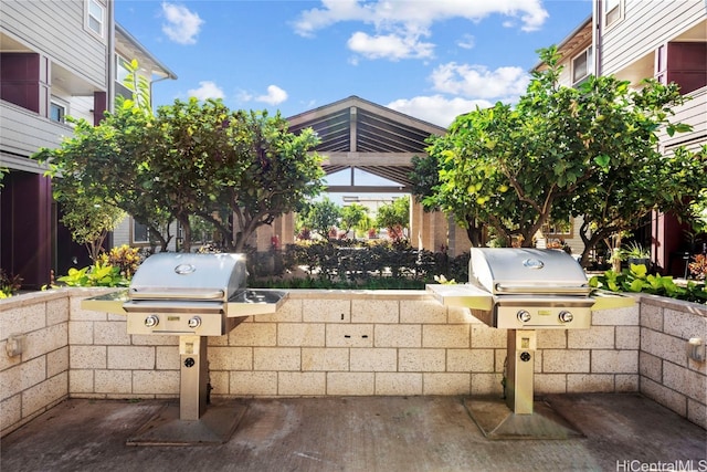 view of patio featuring an outdoor kitchen and area for grilling