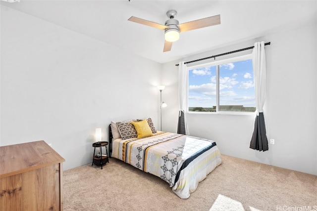 bedroom featuring light carpet and ceiling fan