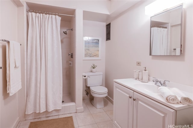 bathroom featuring a shower with shower curtain, vanity, toilet, and tile patterned floors