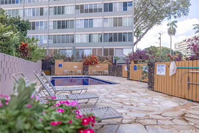 view of pool featuring a patio