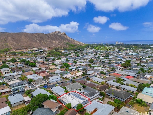 birds eye view of property with a mountain view