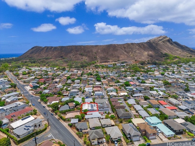 birds eye view of property with a mountain view