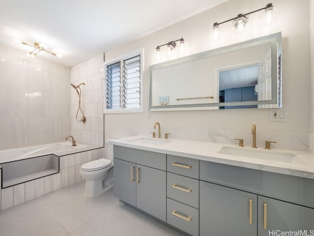 full bathroom with tile patterned floors, vanity, toilet, and tiled shower / bath