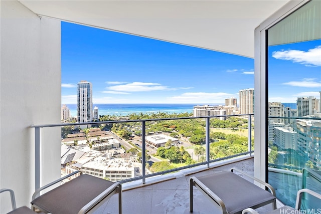 balcony featuring a water view