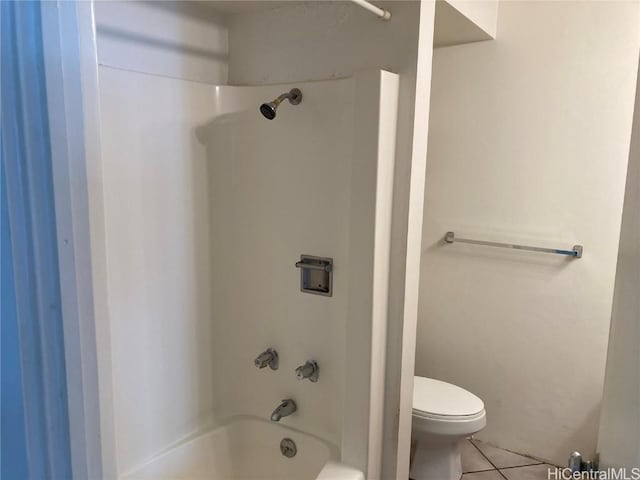 bathroom with shower / bathing tub combination, toilet, and tile patterned flooring