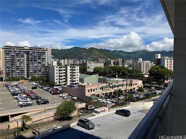 property's view of city with a mountain view