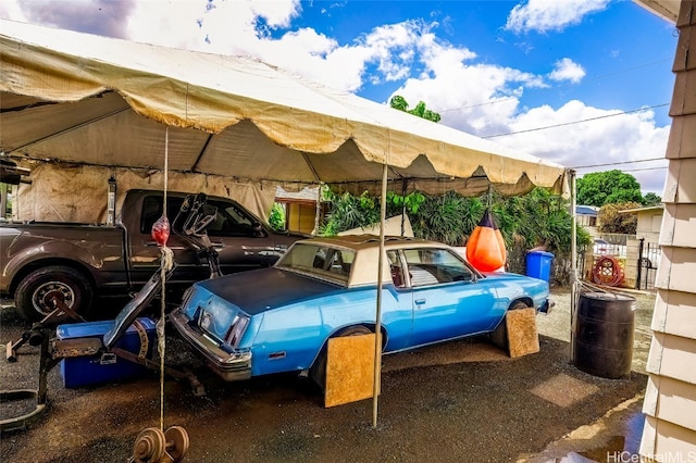 view of vehicle parking featuring a carport