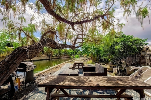 view of patio featuring a water view