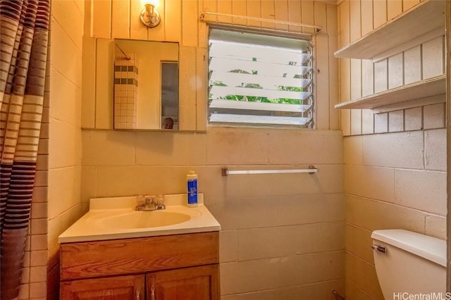 bathroom featuring toilet and vanity