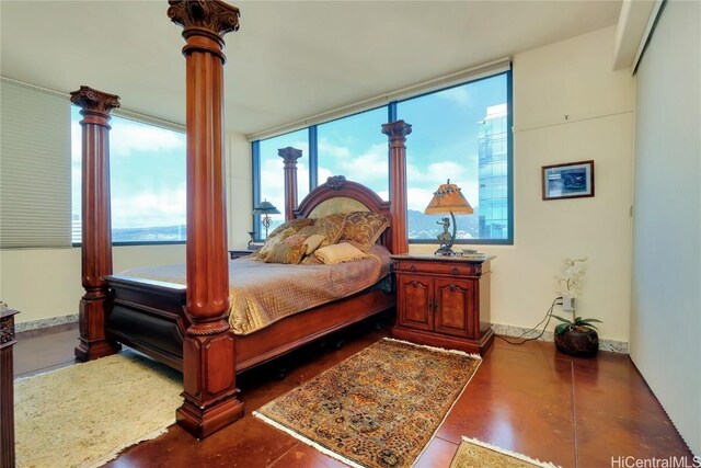 bedroom with ornate columns