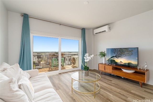 living room with hardwood / wood-style flooring and a wall mounted AC