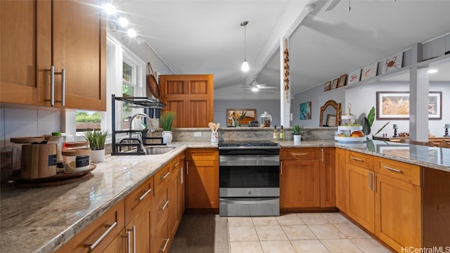 kitchen featuring light stone countertops, sink, stainless steel electric range, lofted ceiling, and light tile patterned floors