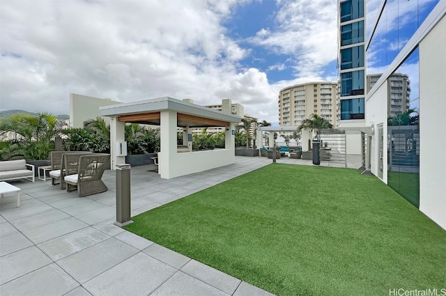 view of yard featuring a gazebo, a patio area, and an outdoor hangout area