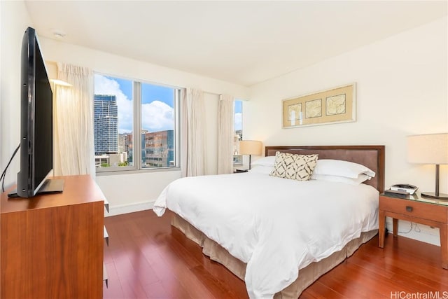 bedroom featuring dark wood-type flooring