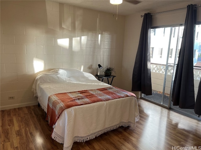 bedroom featuring ceiling fan and dark wood-type flooring