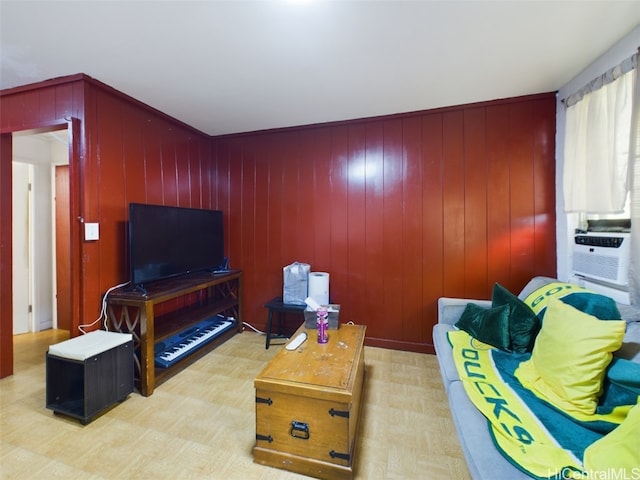 living room with wood walls and cooling unit