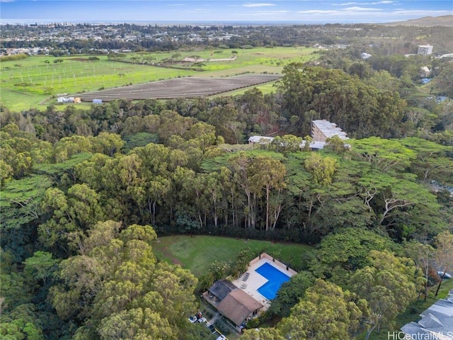 birds eye view of property with a view of trees