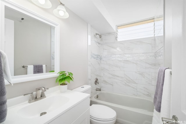 full bathroom featuring toilet, vanity, and tiled shower / bath