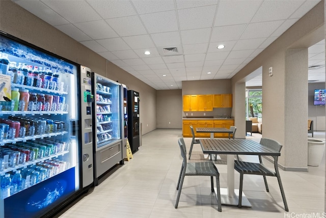 dining area featuring a drop ceiling