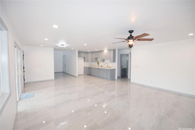 418 Halemaumau St, Honolulu, HI 96821 - unfurnished living room with recessed lighting, a sink, baseboards, and ceiling fan