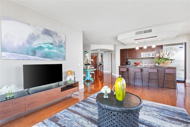 living room featuring dark hardwood / wood-style floors